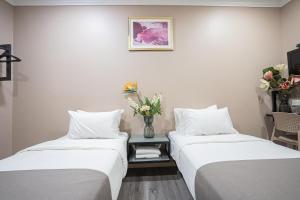Postel nebo postele na pokoji v ubytování HOTEL 28 RAPID