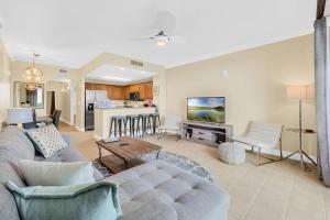 a living room with a couch and a table at K and J Orlando in Orlando