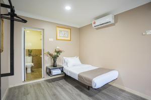 Postel nebo postele na pokoji v ubytování HOTEL 28 RAPID