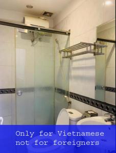 A bathroom at Âu Việt - 168 Ngọc Thụy - by Bay Hostel