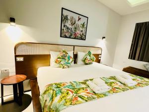 a bedroom with a large bed with towels on it at summer pool villa in Laguna Phuket