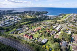 an aerial view of a suburb next to the ocean at Cosy Cottage in Kiama