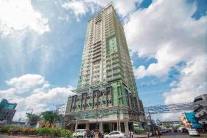 a tall building in a city with a sky at Prime Twin - MIGAs Haven at Sunvida Tower in Carreta
