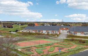 an aerial view of a tennis court with a tennis racket at Fanø Bad, Lejl 53 in Fanø +12 photos