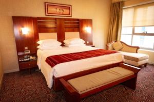 Postel nebo postele na pokoji v ubytování Grand Central Hotel