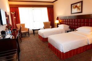 Postel nebo postele na pokoji v ubytování Grand Central Hotel