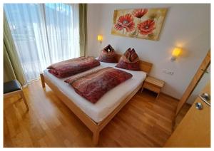 Postel nebo postele na pokoji v ubytování Laerchenlodge + 40 fotografií