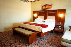 Postel nebo postele na pokoji v ubytování Grand Central Hotel