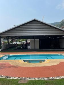 a large building with a pool in front of it at Mipiace in Kamala Beach