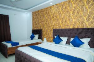 Tempat tidur dalam kamar di Hotel Blossom