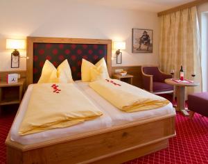 Krevet ili kreveti u jedinici u okviru objekta Hotel Garni Bavaria