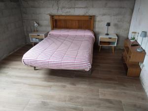 מיטה או מיטות בחדר ב-Casa campo