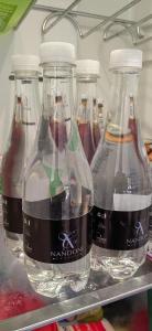 een groep van vier lege flessen frisdrank in een koelkast bij Nandoni Crystal in Thohoyandou