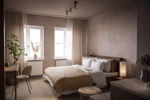 Högbo Brukshotell & Spa tesisinde bir odada yatak veya yataklar