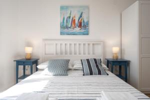 Ένα ή περισσότερα κρεβάτια σε δωμάτιο στο Margola Apartment