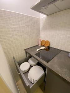 a bathroom with two toilets sitting under a counter at Apartment Rotone in Marciana Marina
