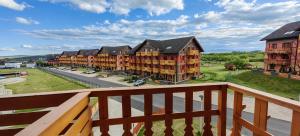 a balcony view of a row of apartment buildings at Apartment FIMM in Veľká Lomnica