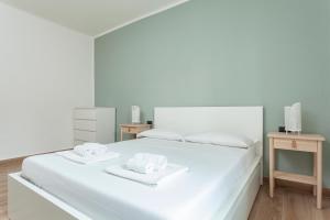 Postel nebo postele na pokoji v ubytování Greenway Apartment