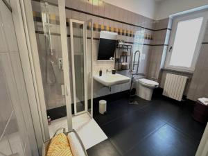 a bathroom with a shower and a sink and a toilet at Villa Alba in Petacciato +75 photos
