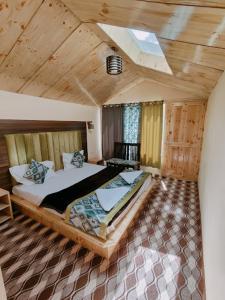 a bedroom with a large bed in a room at The Grand Lodge Pangong in Lukung