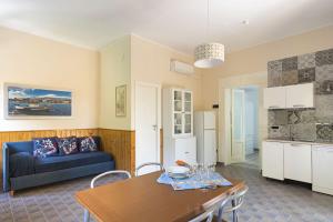 a living room with a couch and a table at Casa Spisone in Taormina