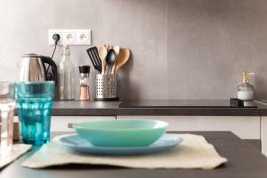 a counter with a bowl on a plate on a table at Wonderful EMOJI studio in oldtown, street parking in Bratislava