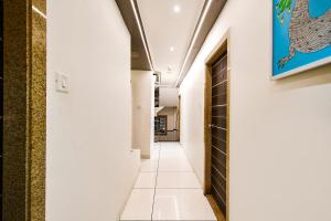 a corridor in a building with a hallway at Hotel Shree Ram Palace in Indore +17 photos