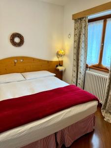 Postel nebo postele na pokoji v ubytování La Rosa Home