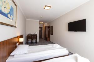 Televizors / izklaižu centrs naktsmītnē Hit Hotel