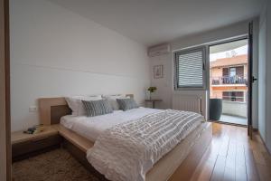 Postel nebo postele na pokoji v ubytování Apartments Valbruna