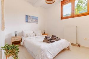Ένα ή περισσότερα κρεβάτια σε δωμάτιο στο Riviera Paradiso +26 φωτογραφίες