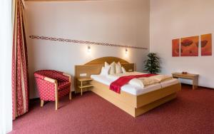 Una cama o camas en una habitación de Hotel Forer