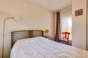 En eller flere senge i et værelse på Vacances au pied du Sémaphore + 13 billeder