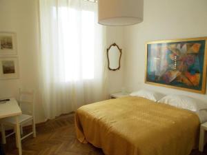 Postel nebo postele na pokoji v ubytování B&B ROSSANA