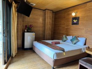 a bedroom with a bed in a room at Thai Cozy House - SHA certified in Bangkok