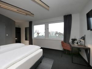 Postel nebo postele na pokoji v ubytování B&B Hotel Berlin City-West