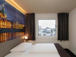 Postel nebo postele na pokoji v ubytování B&B Hotel Berlin City-West