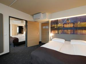 Postel nebo postele na pokoji v ubytování B&B Hotel Berlin City-West