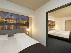 Postel nebo postele na pokoji v ubytování B&B Hotel Berlin City-West