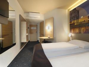 Postel nebo postele na pokoji v ubytování B&B Hotel Berlin City-West