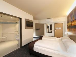 Postel nebo postele na pokoji v ubytování B&B Hotel Berlin City-West