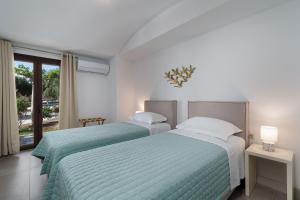 Ένα ή περισσότερα κρεβάτια σε δωμάτιο στο Harmony Luxury Private Villas +88 φωτογραφίες