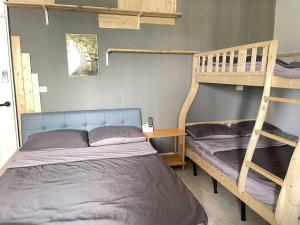 Postel nebo postele na pokoji v ubytování 阿布の家