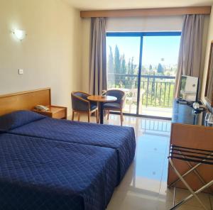 Postel nebo postele na pokoji v ubytování Veronica Hotel