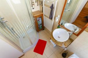 a bathroom with a sink and a shower at Badepest Apartment Budapest in Budapest