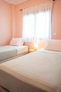 Postel nebo postele na pokoji v ubytování nárciso, elegant living