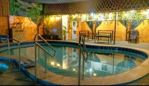 a swimming pool in a hotel with lights on it at Diez Private Pool in Calamba