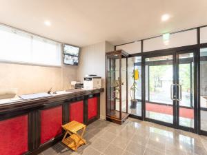 a bar in a room with a red counter at Nasu Kogen North Inn in Higashikoya