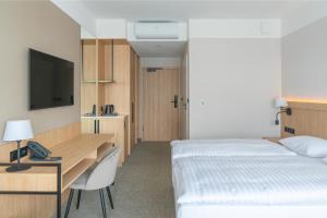 Postel nebo postele na pokoji v ubytování Hotel Continental + 37 fotografií
