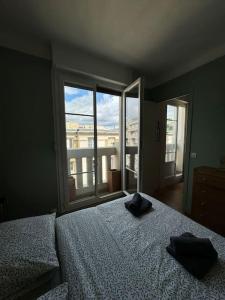 Krevet ili kreveti u jedinici u okviru objekta Charmant appartement parisien